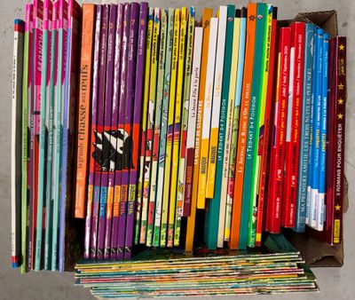 a box full of children ' s books sitting on the floor