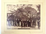 a group of men in uniform posing for a picture