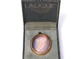 an image of a gold ring with a pink stone in it