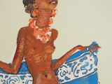 a painting of a woman sitting on a blue and white bed