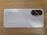 the back of a white phone with a camera on top of it