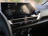 the dashboard of a car with a digital display in the center