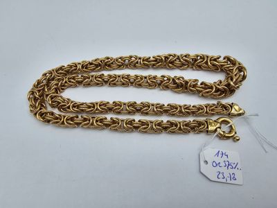 a gold chain necklace with a tag on it