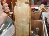 a person holding a pitcher filled with ice and water