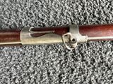 an old rifle that is laying on the ground