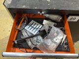 a tool box with tools inside of it on the floor