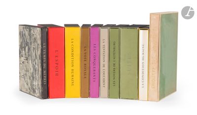 a lot of books that are lined up on a shelf