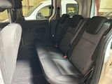 the back seats of a small van with a black seat belt