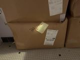 a box with a spider on it sitting on the floor