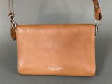 an image of a tan leather purse with a chain around it