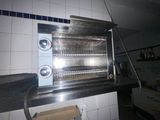 a toaster oven that is sitting on a counter in a kitchen