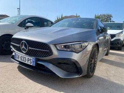 the mercedes cla is parked in a parking lot next to other cars