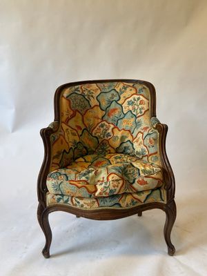 an image of a chair with a floral upholstered seat
