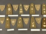 several pieces of cloth with different designs on them on a table