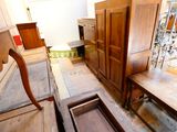 a lot of furniture in a room that is being remodeled