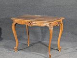 a wooden table with a marble top on a grey background