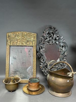 a picture of a picture frame, a mirror, and a teapot on a table
