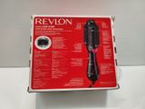 the box of a hair dryer is open on a table