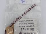 an image of a coin in a plastic bag with a label on it