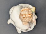 a figurine of a man with a beard and glasses