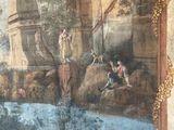 painting on the wall of a building with a painting of a man and a woman