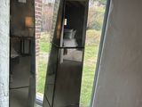two mirrors that are standing in the corner of a room