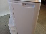 an image of a small air conditioner in a room