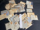 a pile of old envelopes on a black table