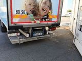 a truck that has a picture of two children on the back of it