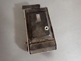 a small metal box that has a button on it