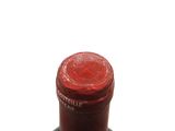 a bottle of wine that is sitting on a table