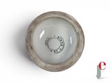 a white bowl with a black and white design on it