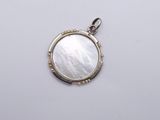 an image of a mother of pearl pendant on a white background