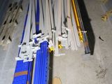 a pile of construction materials on the floor in the garage