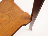 a close up of a wooden chair on a white surface