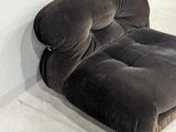 a chair that is sitting in the corner of a room