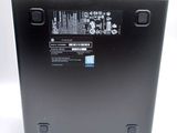 the back of a laptop with a battery on top of it