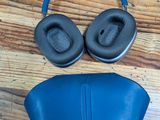 a pair of headphones and a pair of eye mask on the floor