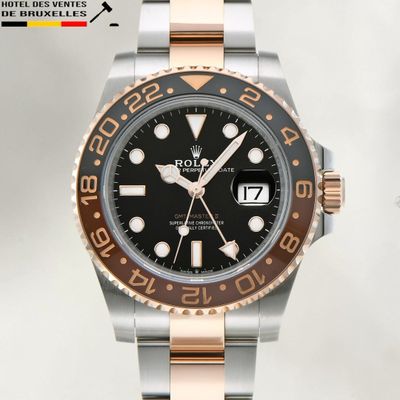 rolex watch with two tone steel bracelet and black dial