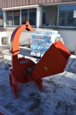 a red machine that is sitting in the snow
