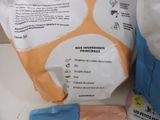 a bag of baby food sitting on a counter next to a bag of milk