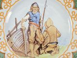 a plate with a picture of a man and a woman on it