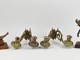 four bronze statues of a man on a horse and a man on a horse