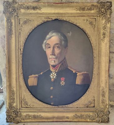 portrait of a man in a military uniform in a gold frame
