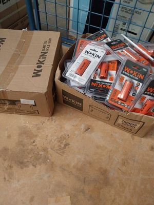 a box of batteries sitting on the floor next to a carton of batteries