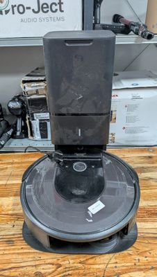 an image of a coffee maker sitting on top of a wooden table