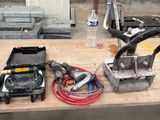 some tools are sitting on a wooden table in a room