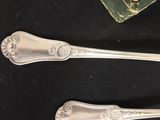 two spoons that are sitting on a table