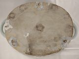 a white plate with holes on it on a table