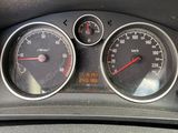 a close up of a car dashboard with gauges and speedometers